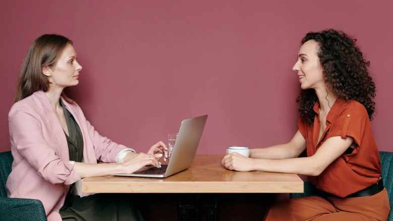 New employee talking to their manager over a cup of tea